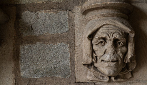 Close-up of statue against wall