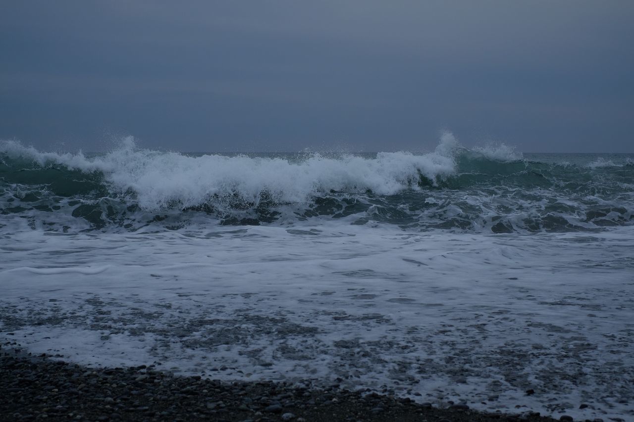 VIEW OF WAVES ON SHORE