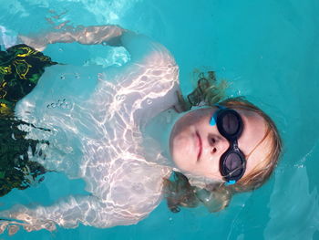 Portrait of woman swimming in pool