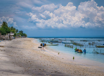 Scenic view of sea against cloudy sky