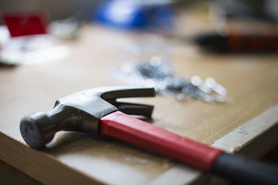 Close-up of hammer on table