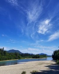 Scenic view of landscape against blue sky