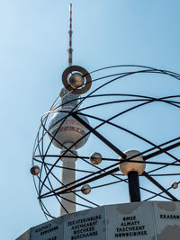 Low angle view of communications tower against clear sky