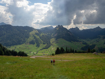 Scenic view of landscape and mountains against sky