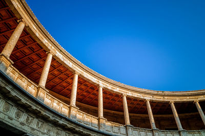 Low angle view of building against clear blue sky