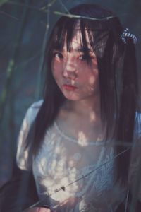 Close-up portrait of young woman outdoors