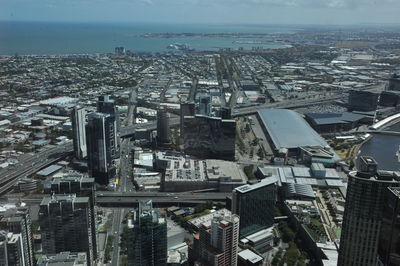 High angle view of modern buildings in city against sky