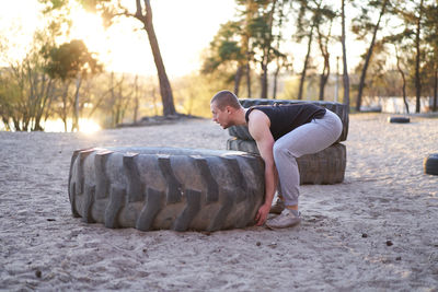 Full length of young man lying down on land