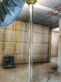 Reflection of person on mirror in bathroom