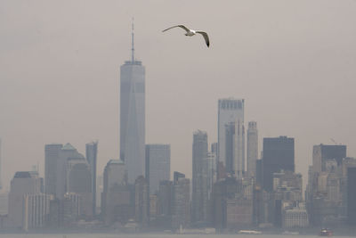 View of skyscrapers in city against sky