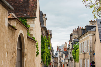 Low angle view of old buildings against sky