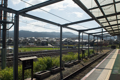 Railroad station platform seen through train windshield