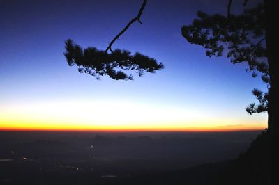 Scenic view of silhouette landscape against clear sky at sunset