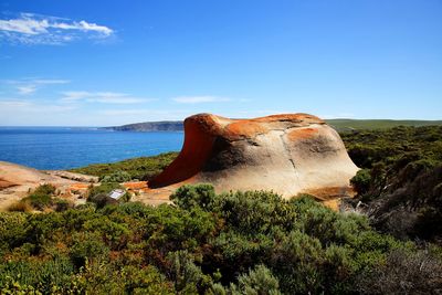 Scenic view of sea against blue sky
