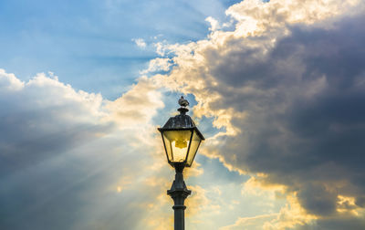 Low angle view of tower against cloudy sky