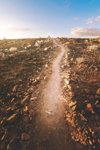 Aerial view of land on road against sky