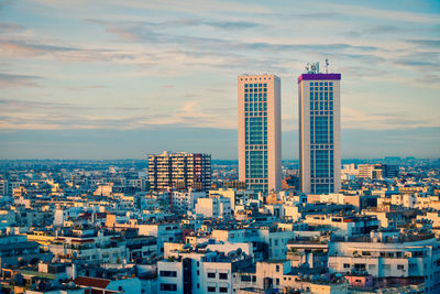 High angle view of buildings in city against sky