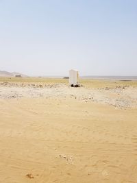 Scenic view of beach against clear sky