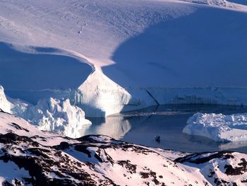 Scenic view of snow covered mountains