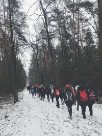 People on snow covered landscape during winter