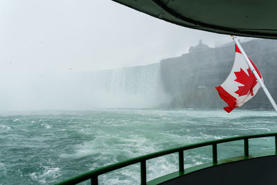 Close-up of flag against sea