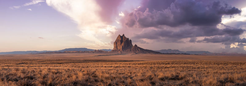 Panoramic view of arid landscape against sky