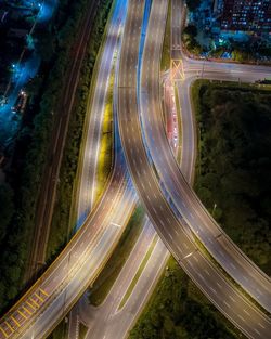 High angle view of light trails on highway at night