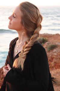 Woman looking at sea shore