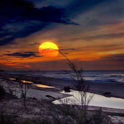 Scenic view of sea at sunset