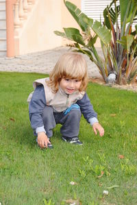 Full length of cute girl playing in yard