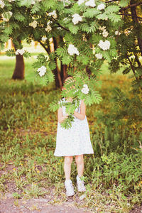 Young woman holding flowers