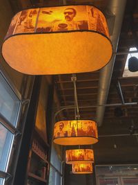 Low angle view of illuminated lanterns hanging on ceiling