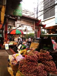 People at market stall in city