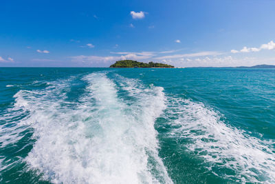 Scenic view of sea against blue sky