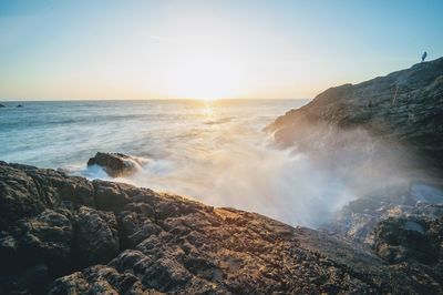 Scenic view of sea against sky during sunset