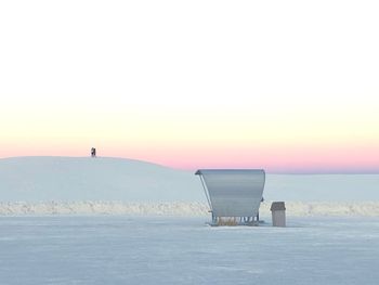 Scenic view of sea against clear sky during winter