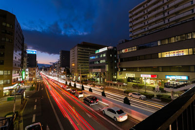 Illuminated city road at night