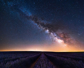 Scenic view of star field against sky at night