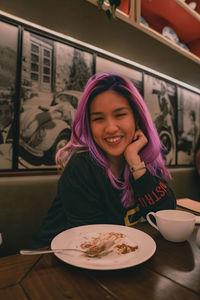 Purple hair asian woman expression