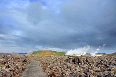 Scenic view of land against sky