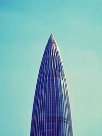 Low angle view of modern building against clear blue sky