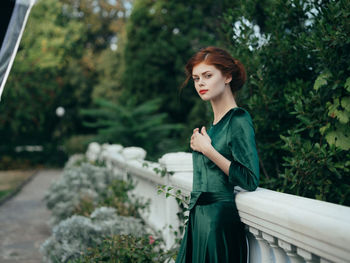 Portrait of a beautiful young woman standing outdoors