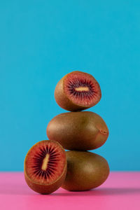 Close-up of kiwi against blue background