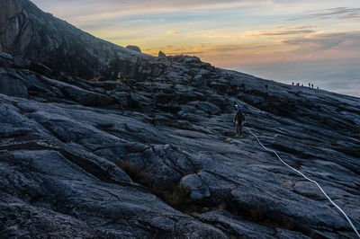 Scenic view of dramatic landscape against sky during sunset