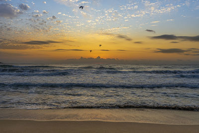 Scenic view of sea against sky during sunset