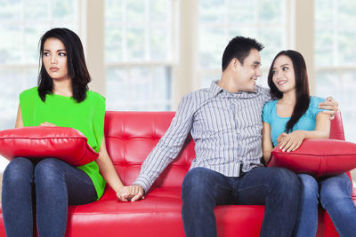 Young couple sitting on sofa