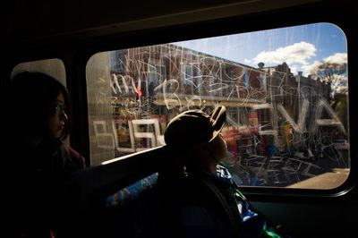 People traveling by bus in city