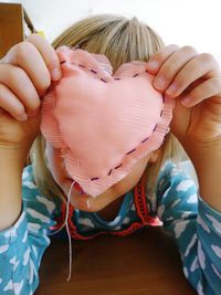 Close-up of cute girl holding hands