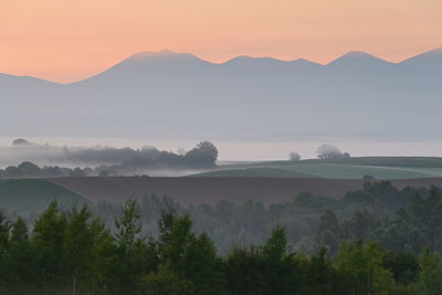 Scenic view of mountains against sky during sunset