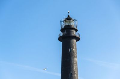 Low angle view of lighthouse against blue sky at sorve in saaremaa island